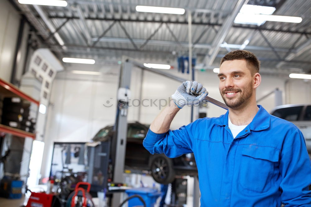 Similar – Image, Stock Photo Mechanic checking wheel of a customized motorcycle