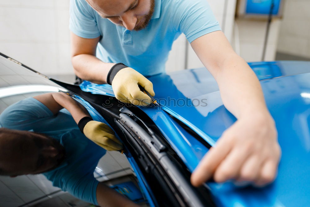 Similar – Professional Mechanic Repairing Car Engine.