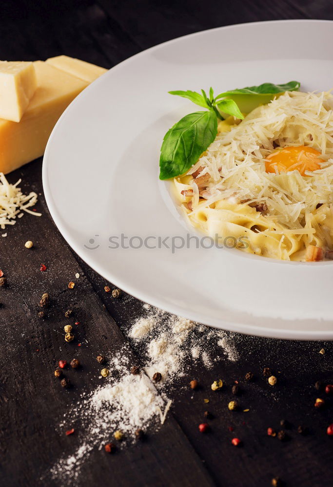 Similar – Image, Stock Photo Spaghetti Carbonara in old pot with parmesan and herbs.