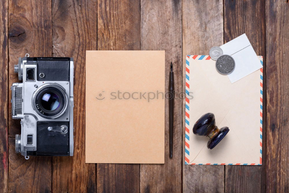 Similar – Camera, glasses and notepad on wood