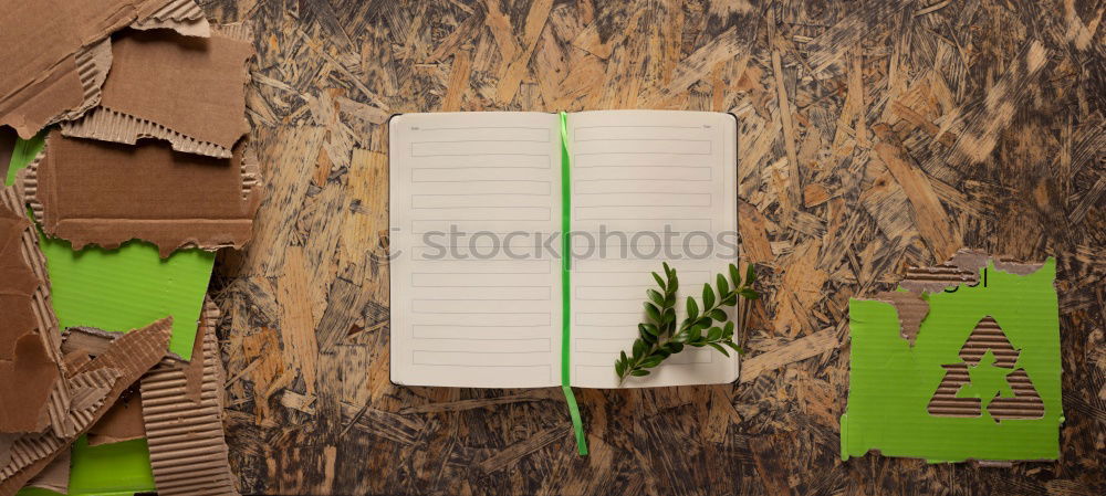 Similar – Green office: notepad with pencil, eraser, sharpener, hole punch and a cup of coffee