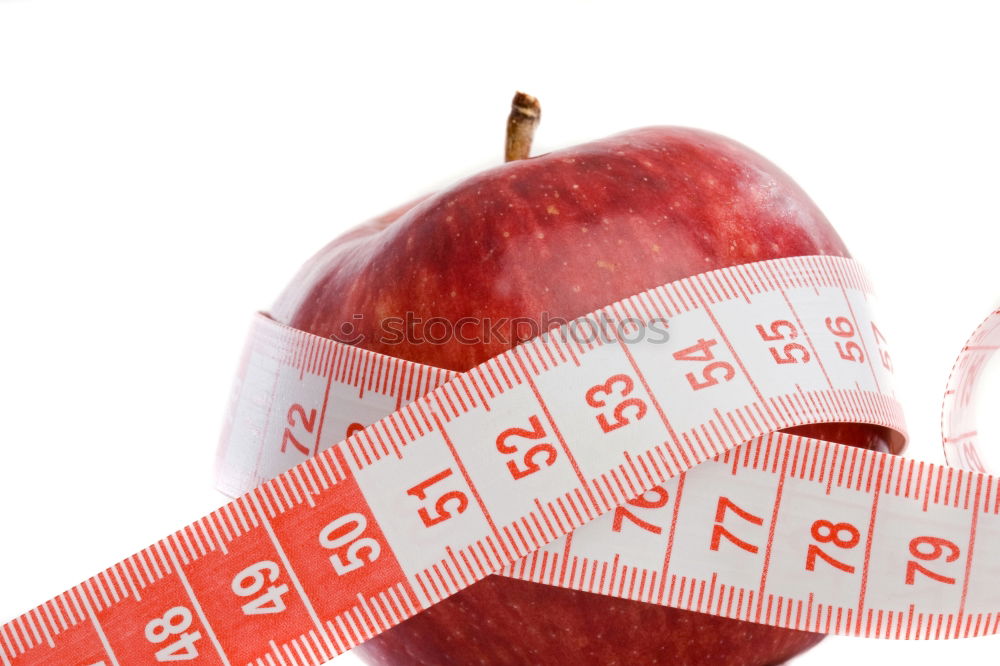 Similar – Red apple with a tape measure