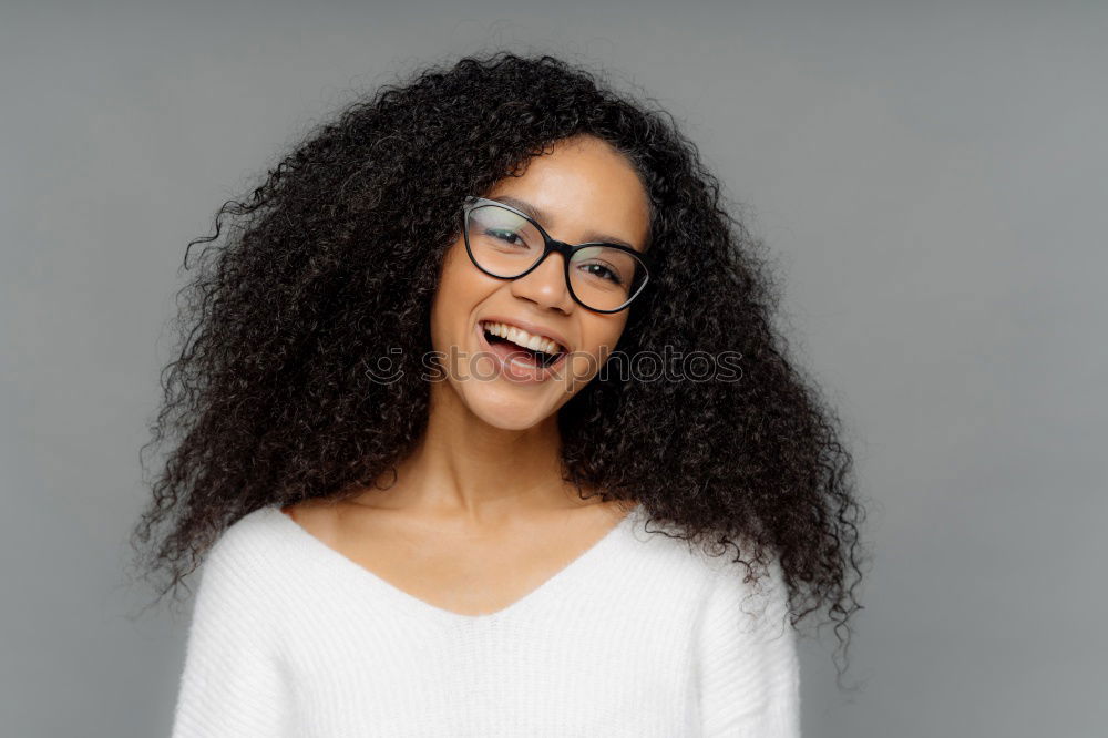 Similar – Young black woman with afro hairstyle smiling.