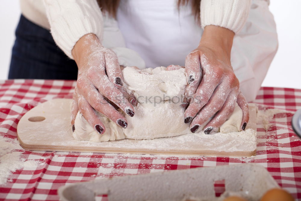 Similar – woman kneading bread dough with her hands