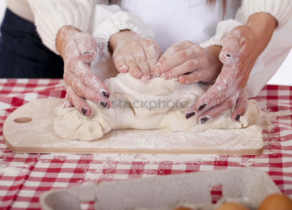 Similar – woman kneading bread dough with her hands