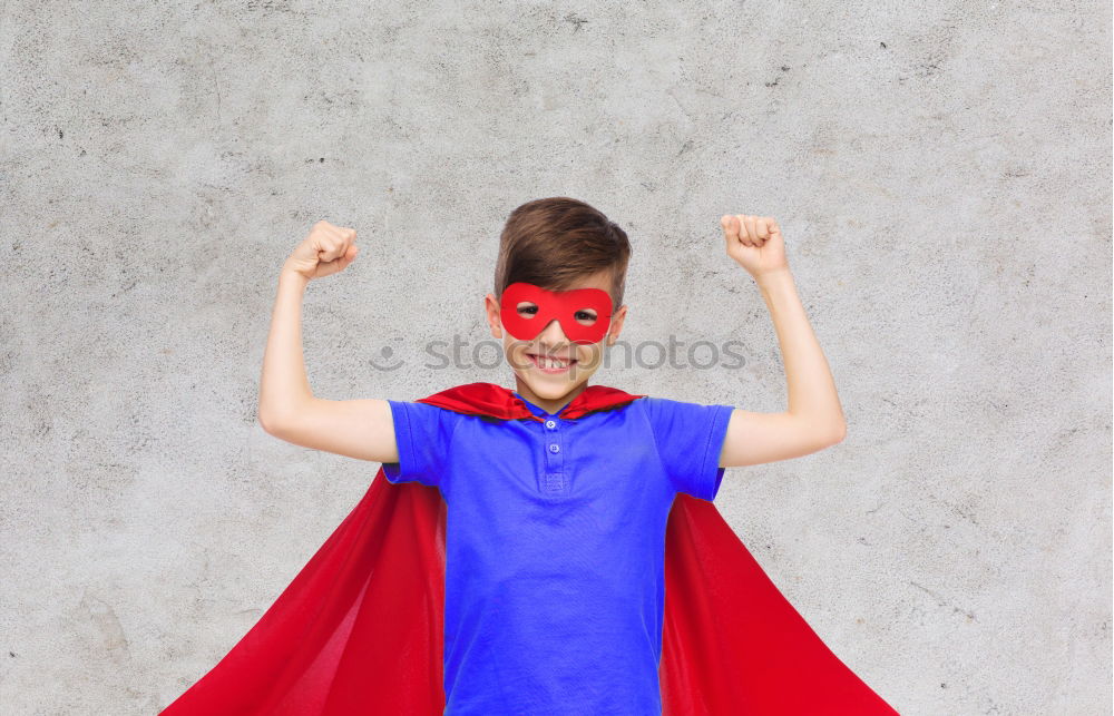 Similar – Happy little child playing superhero. Kid having fun outdoors. Concept of girl power.