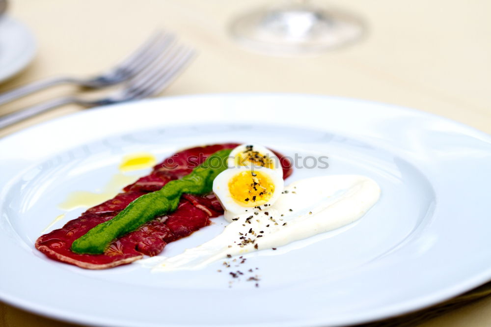 Similar – dinner with beef on a pure white dinner plate