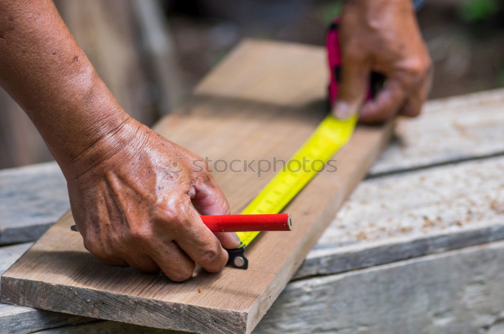 Similar – Carving stone, craftsman shaping stone