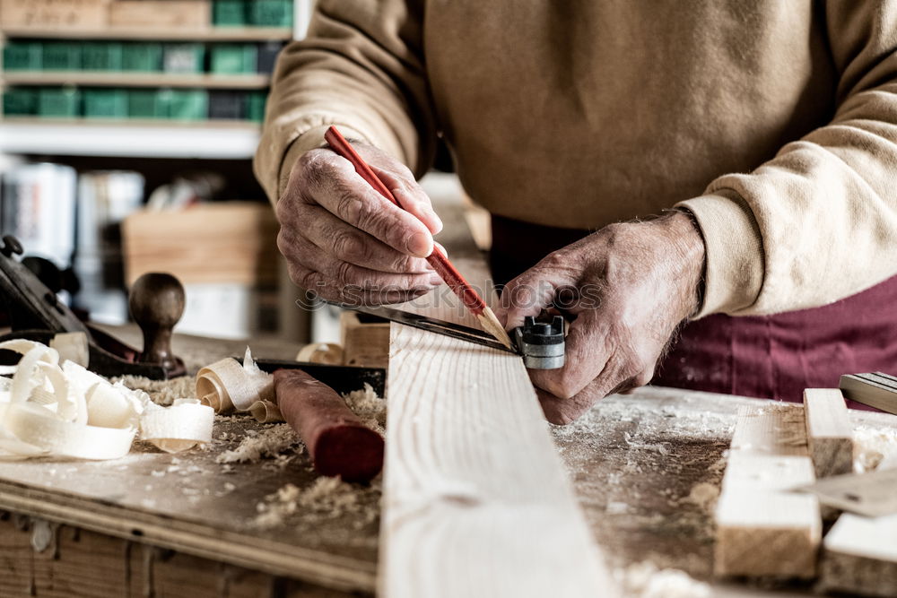 Similar – Craftsman working in his workshop wooden boxes