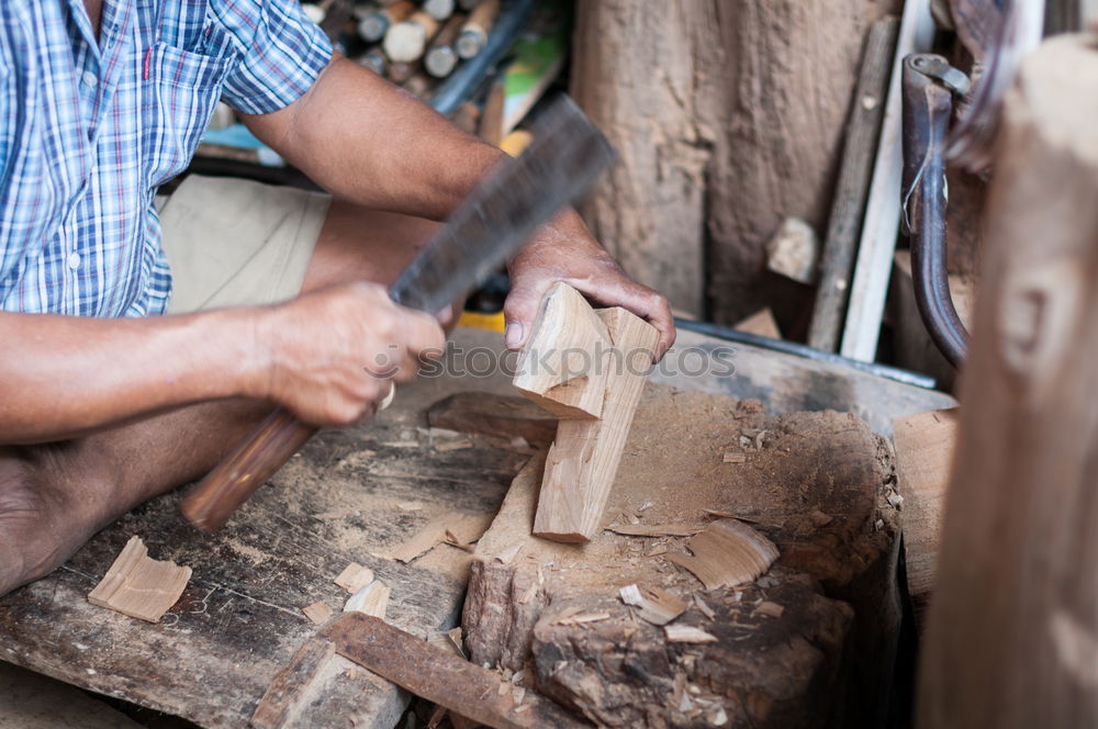 Similar – Carpenter cutting wooden board at his workshop