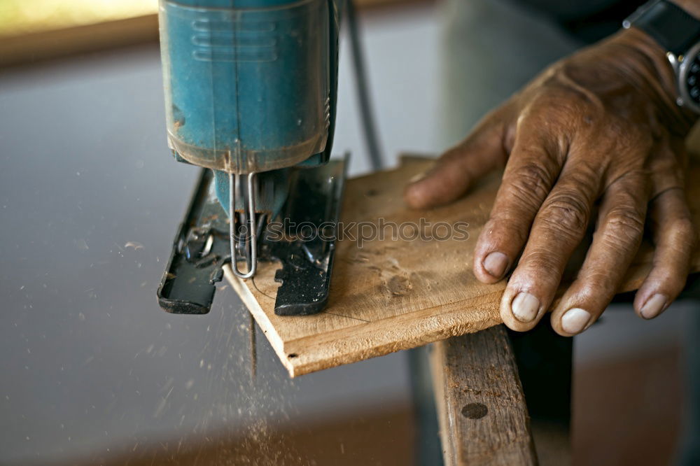 Similar – man’s hands goldsmith work on a piece of silver