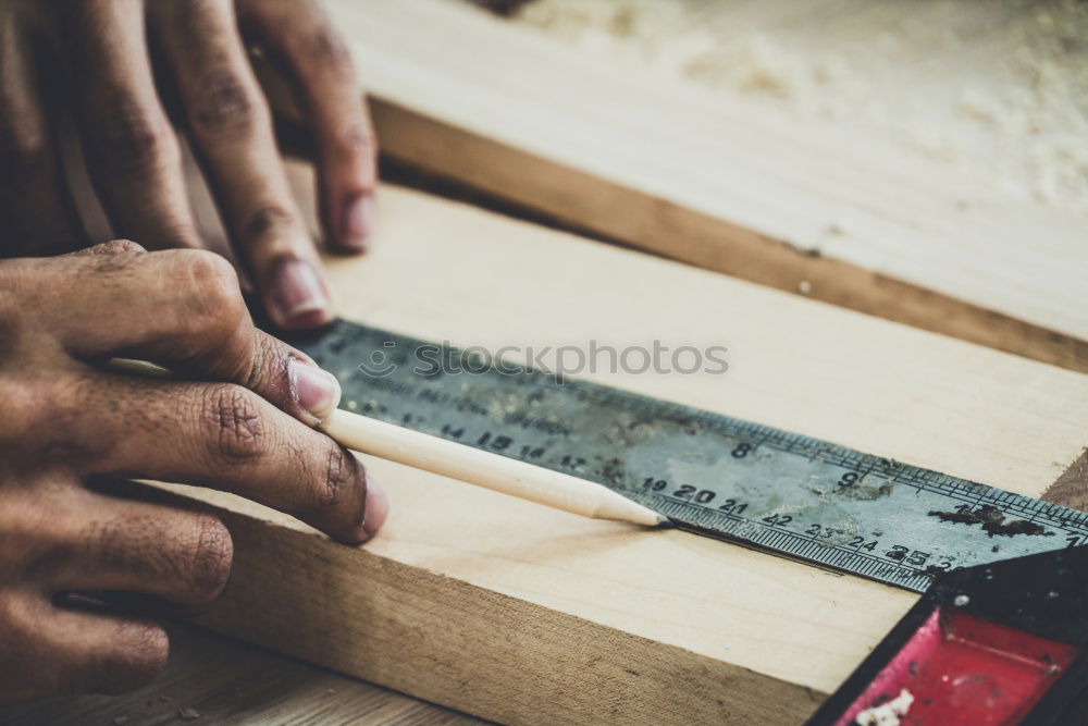 Similar – Image, Stock Photo Carpenter working with a chisel and a hammer.