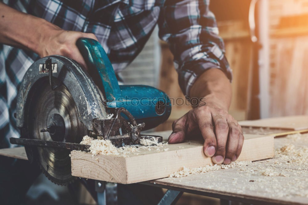 Similar – Man shoeing horse near stable