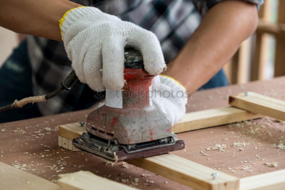 Similar – Image, Stock Photo Carpenter works with a chisel and a hammer.