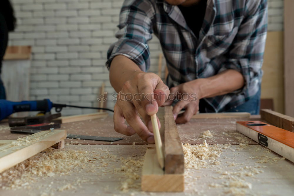 Similar – Craftsman working in his workshop wooden boxes