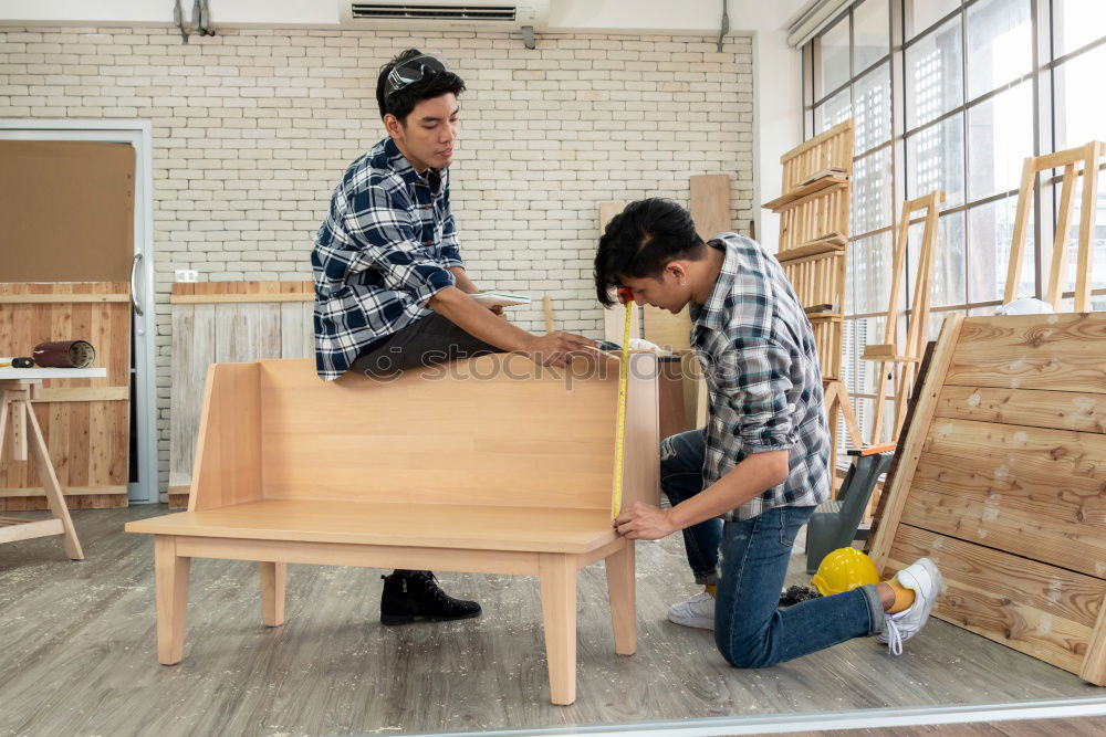 Similar – Image, Stock Photo Focused child polishing wood in workshop with unrecognizable grandfather