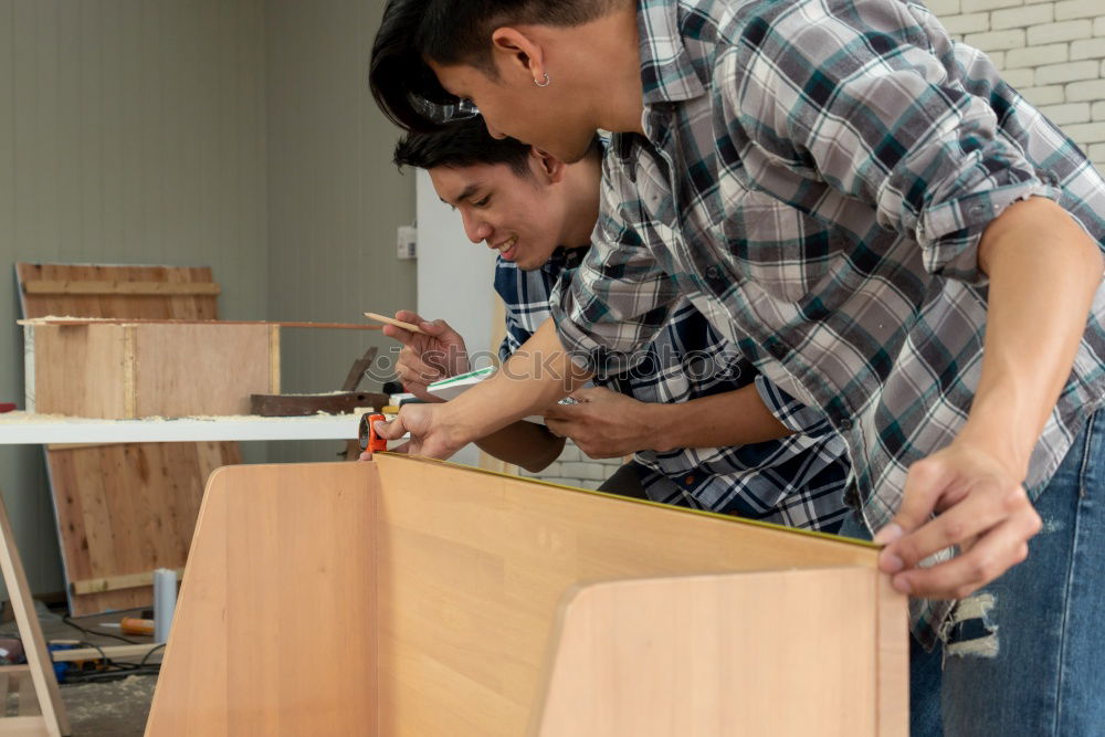 Similar – Image, Stock Photo Focused child polishing wood in workshop with unrecognizable grandfather