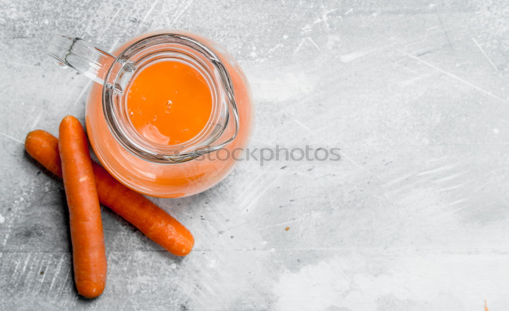 Similar – Iron mug with carrot juice in female hands