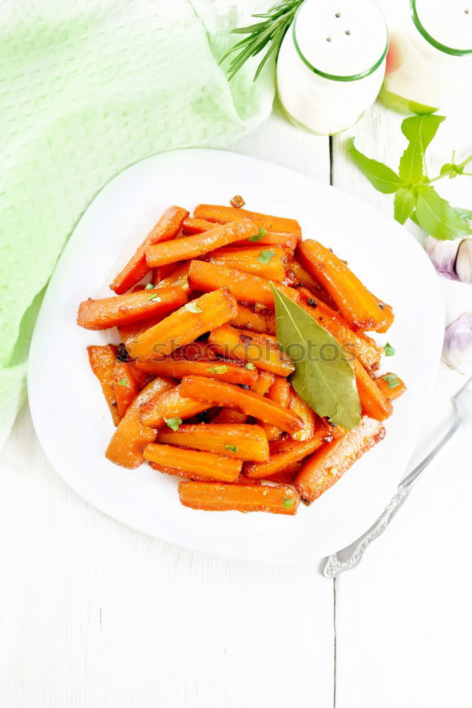 Similar – Image, Stock Photo Carrots with thyme, garlic, lemon and honey on a baking tray