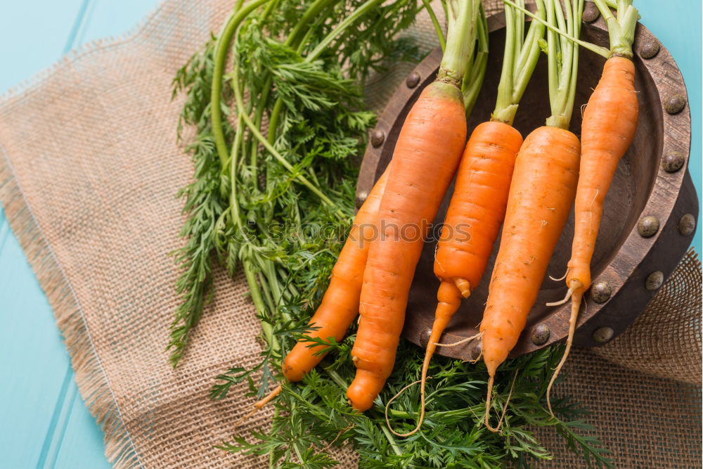 Image, Stock Photo Fresh raw carrots with leaves on a wooden table