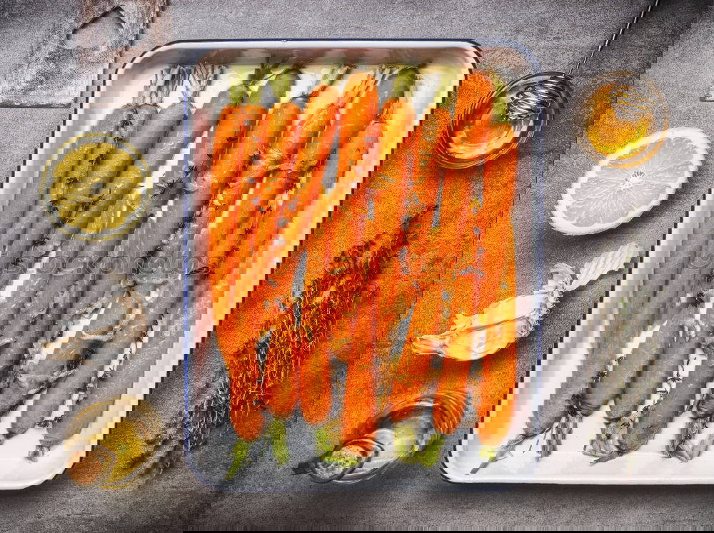 Image, Stock Photo Carrots with thyme, garlic, lemon and honey on a baking tray