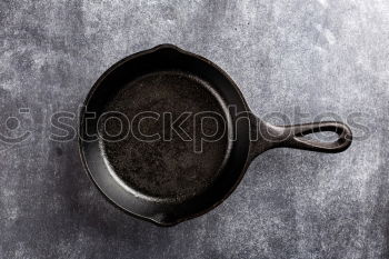 Empty black cast-iron frying pan