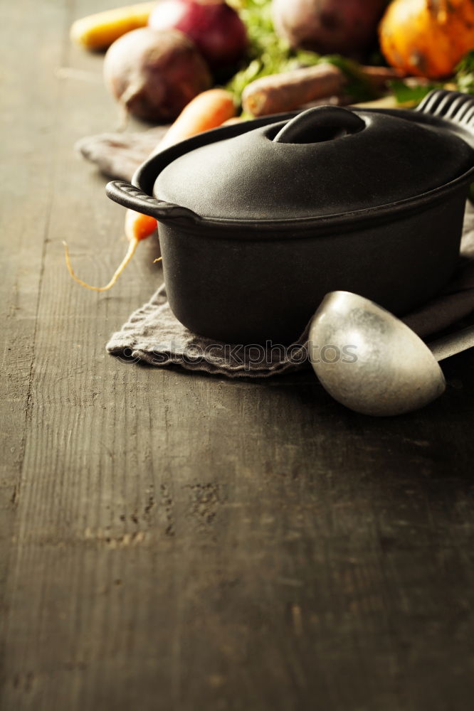 Similar – Image, Stock Photo Empty wok pan on kitchen table with chopsticks and vegetarian Asian food ingredients, top view. Copy space.  Healthy eating and cooking