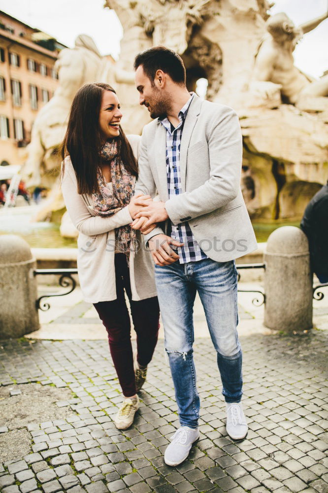 Similar – Happy loving couple. Happy young man piggybacking his girlfriend.