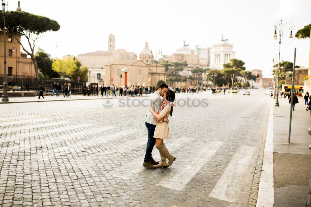 Similar – Boyfriend embracing his girlfriend in the street