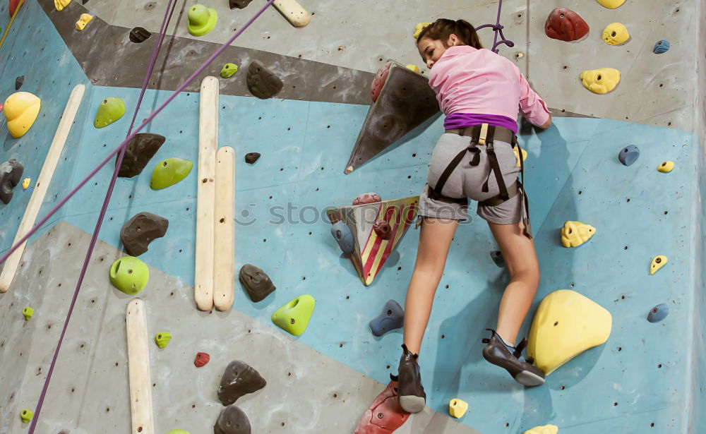 Image, Stock Photo little girl climbing a rock wall outdoor. Concept of sport life.