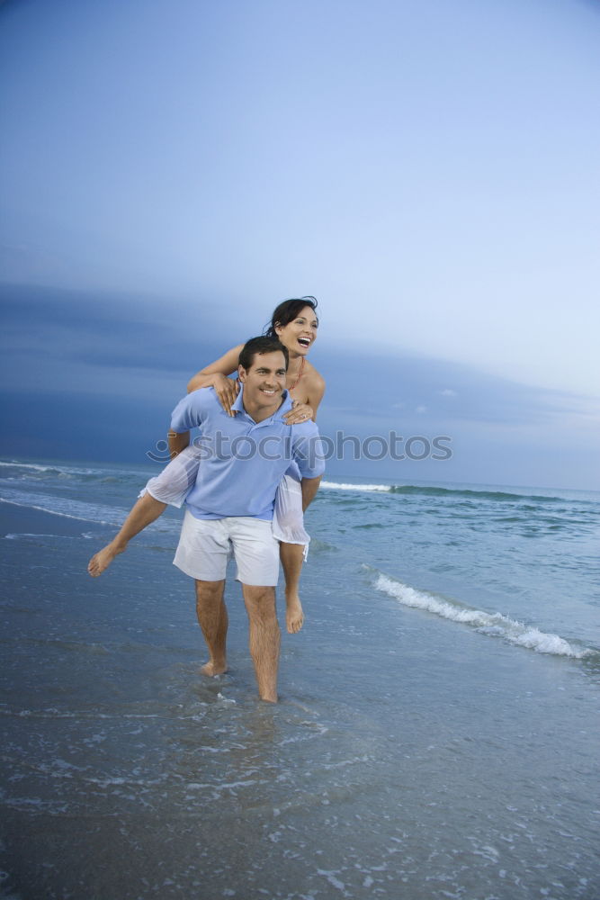 Similar – Image, Stock Photo Father and son playing on the beach at the day time.
