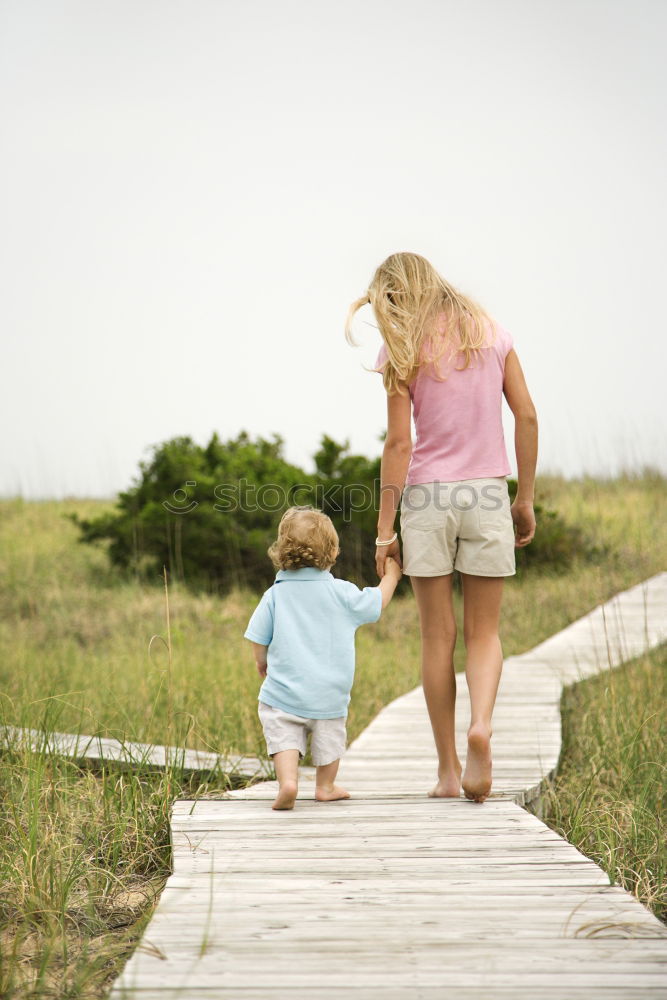 Similar – Image, Stock Photo Father and son playing at the park near lake at the day time.