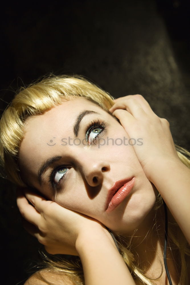 Similar – young leggy woman with pink hair sits in front of couch