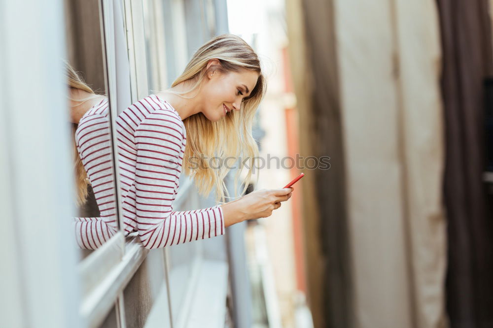 Similar – young woman with phone outdoors