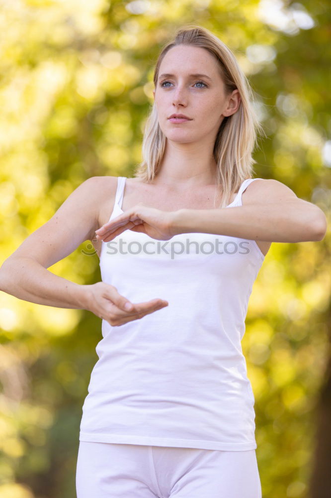 Similar – Beautiful young woman meditates in yoga asana Padmasana