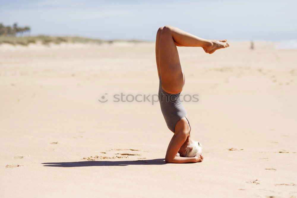 Similar – Caucasian blonde woman practicing yoga in the beach