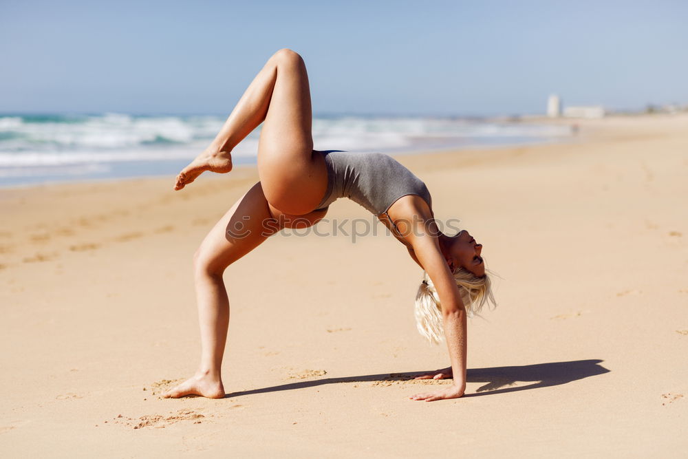 Similar – Image, Stock Photo Caucasian blonde woman practicing yoga in the beach