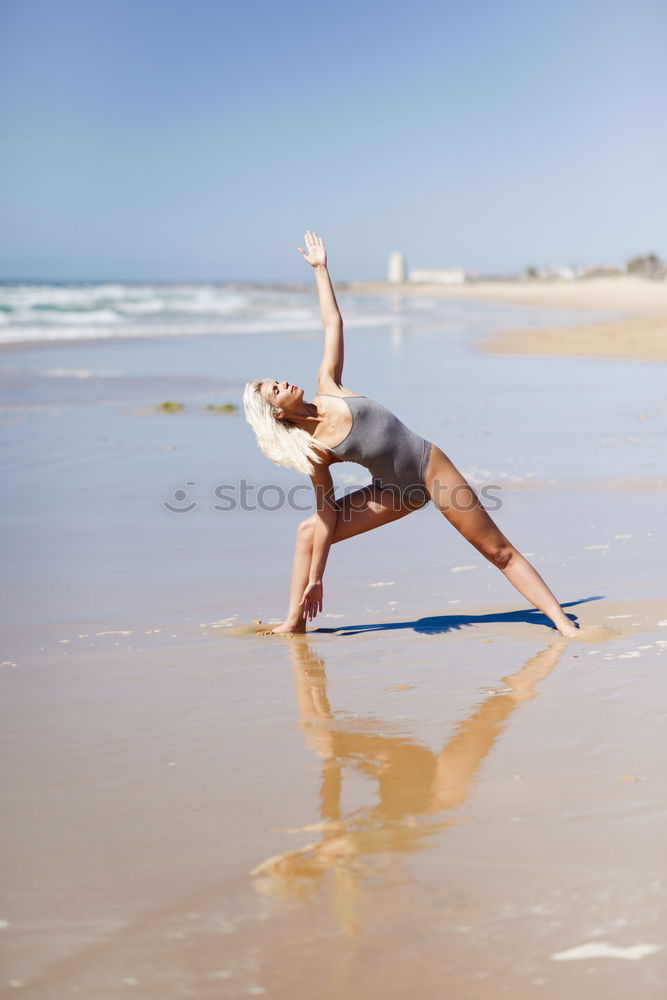 Similar – Caucasian blonde woman practicing yoga in the beach