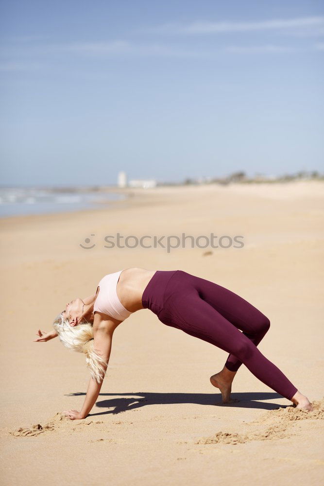 Image, Stock Photo Caucasian blonde woman practicing yoga in the beach