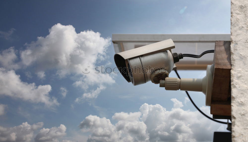 Similar – Industrial Security CCTV Camera installed on metal fence. The camera protects the industrial ground. Blue sky is on the background.