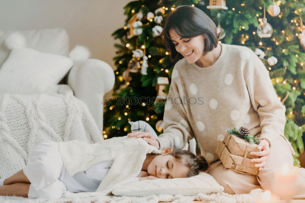 Similar – Image, Stock Photo Mother and son putting christmas costume on