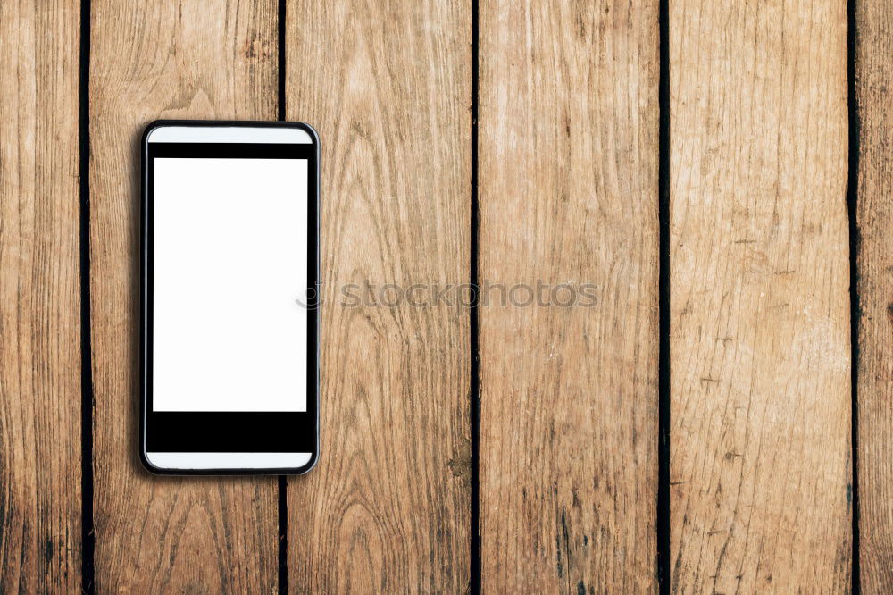 Similar – White Mobile Phone With Blank Screen On Wood Table