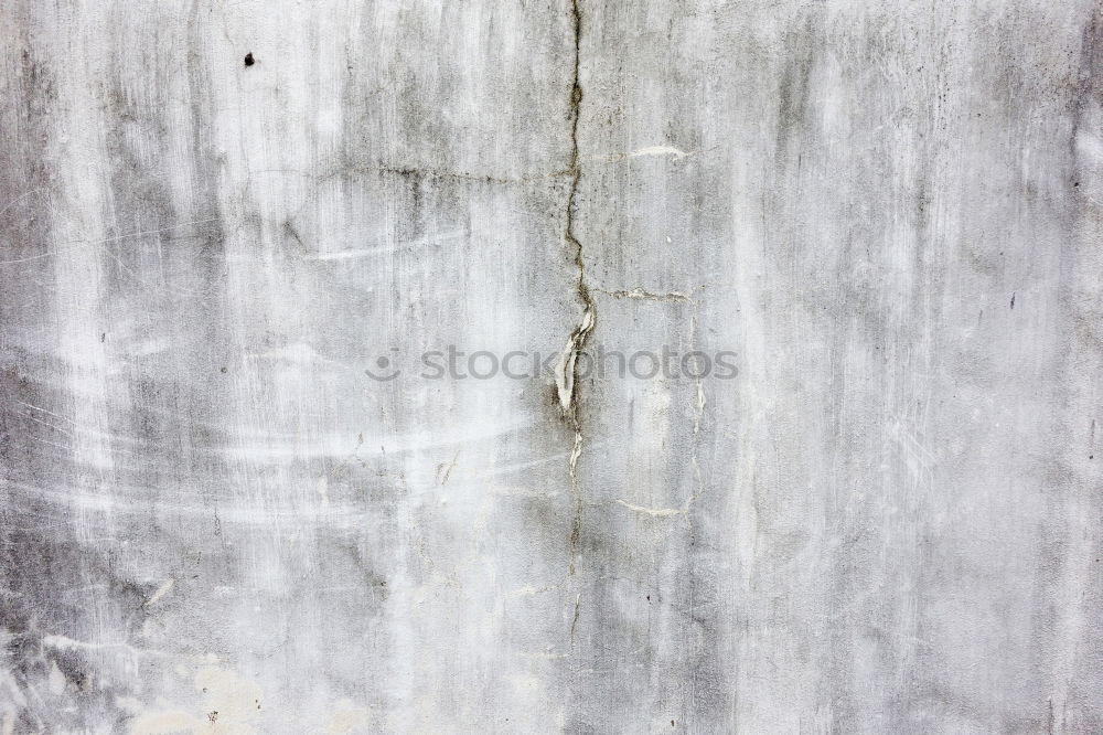 Similar – A piece of white adhesive tape over a crack in the plaster of a house wall