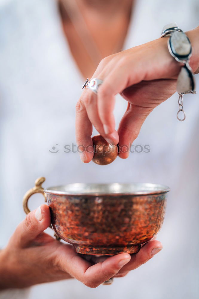 Similar – Image, Stock Photo Hand playing yoga bowls outdoors.