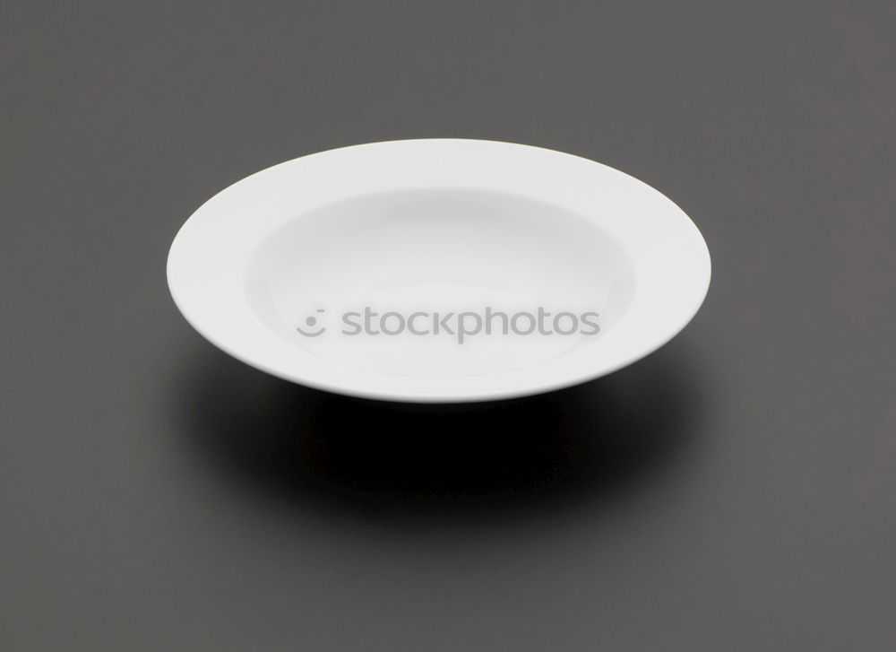 Similar – Image, Stock Photo Empty bowl on black wood in bird’s eye view