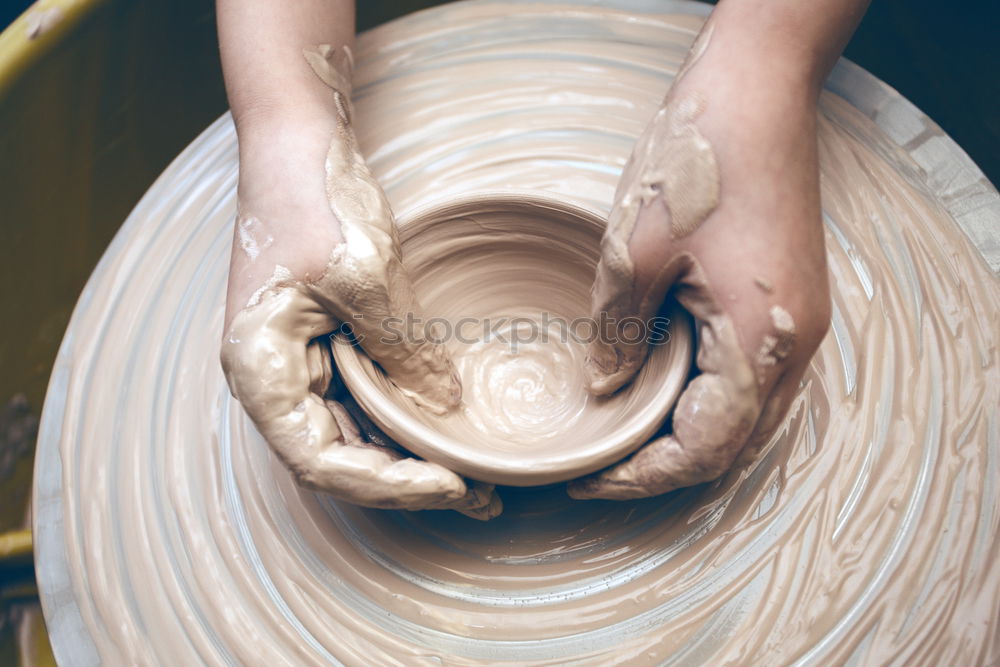 Similar – Hands of woodcarver make ??wooden bowl