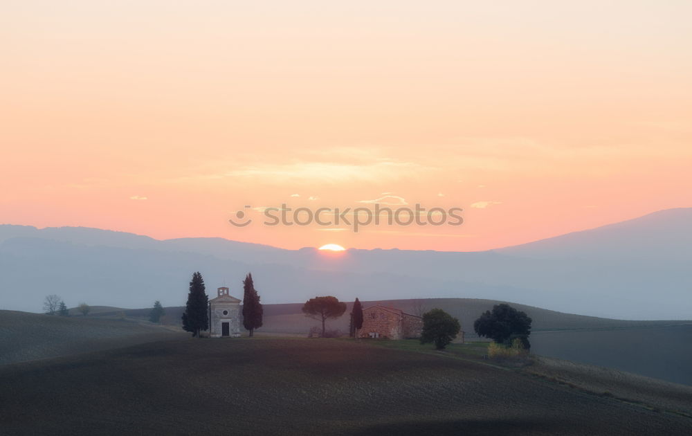 Similar – Winding paths with cypress trees between the green fields.