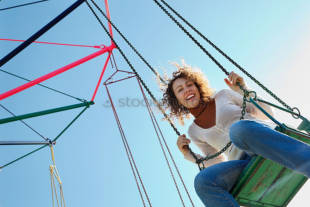 Similar – Woman with afro hair climbing by children’s attractions.