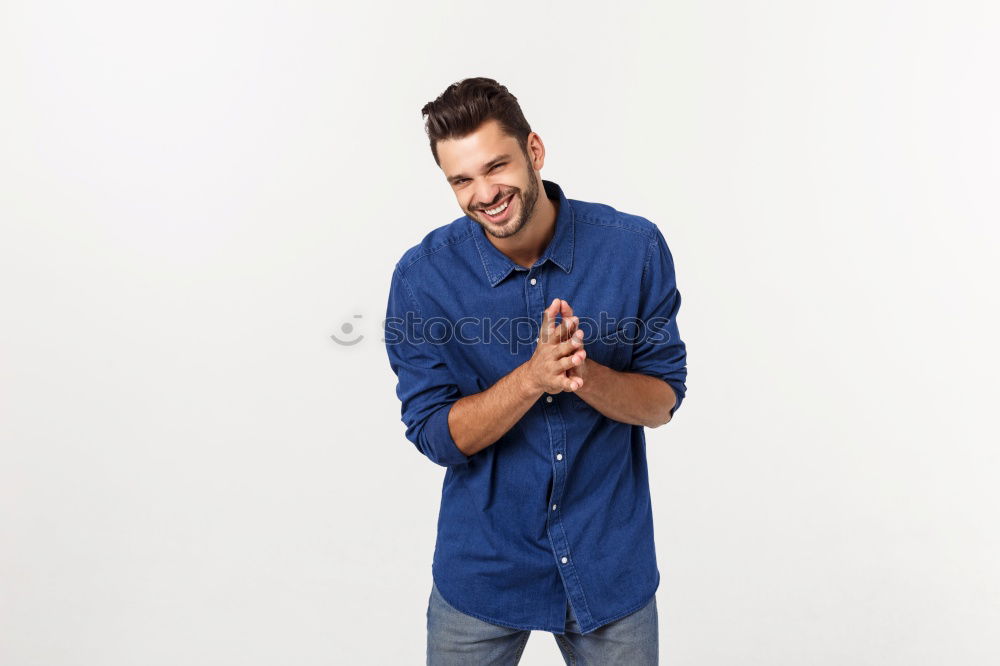 Similar – young handsome man with t-shirt against a wall in street