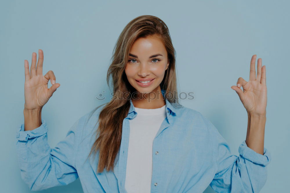 Similar – Image, Stock Photo Happy woman sitting outdoors putting her hand near the camera.